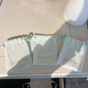 THREE enewton jewelry bags